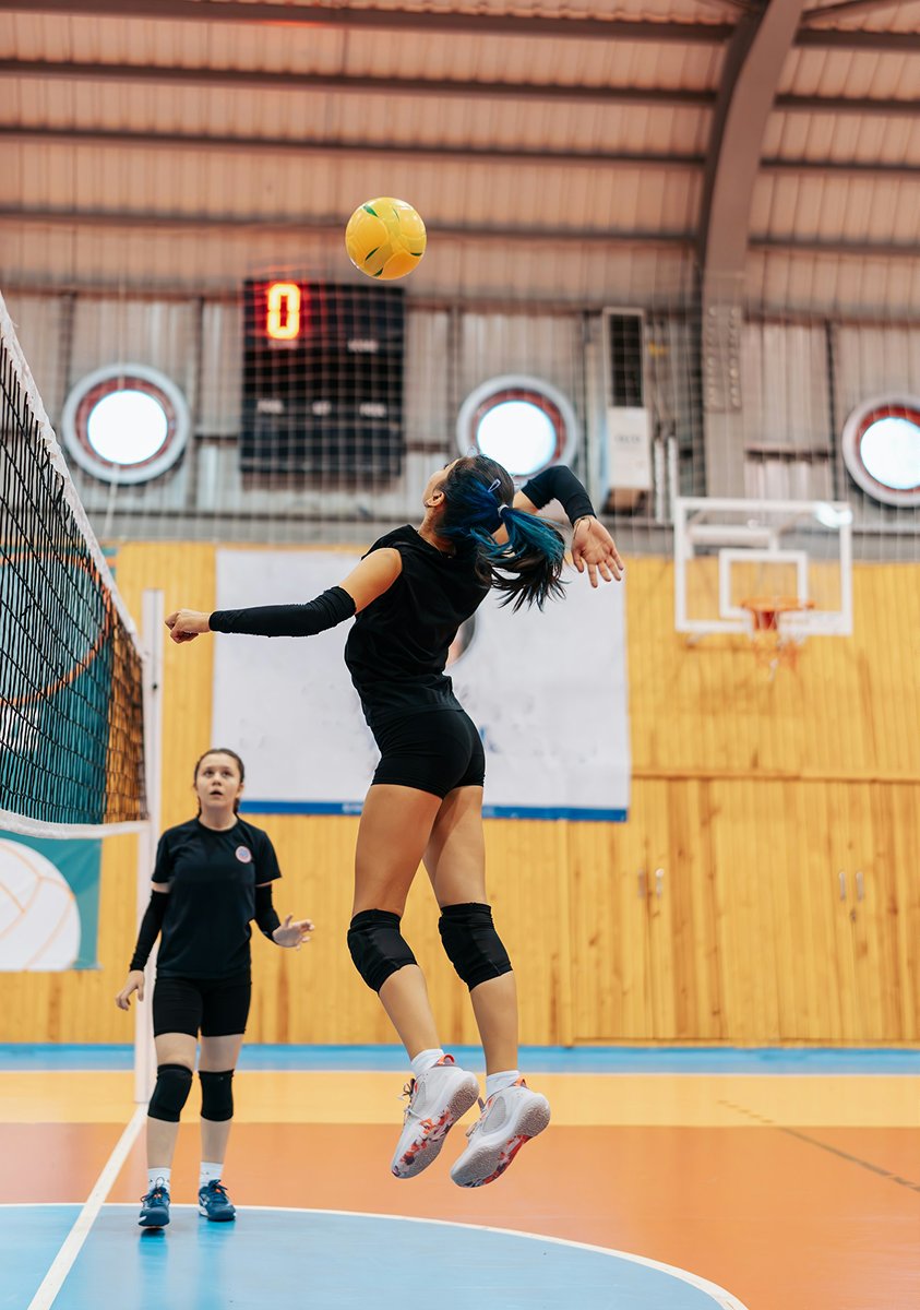 Volleyball player jumping during a match