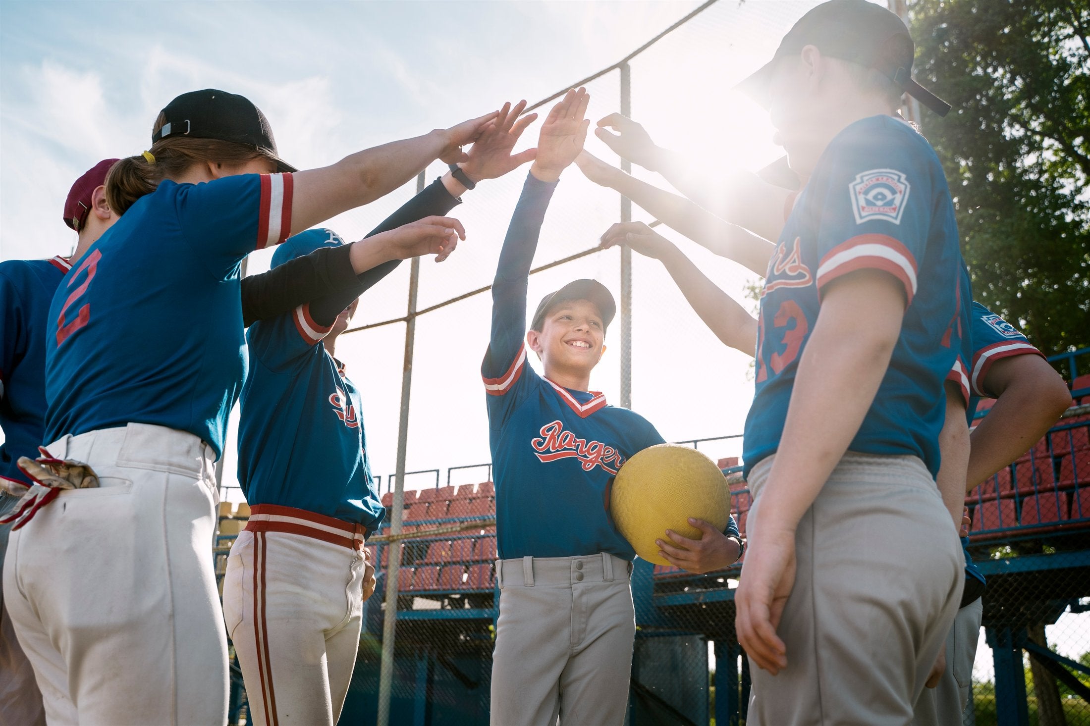 Baseball team celebrating together