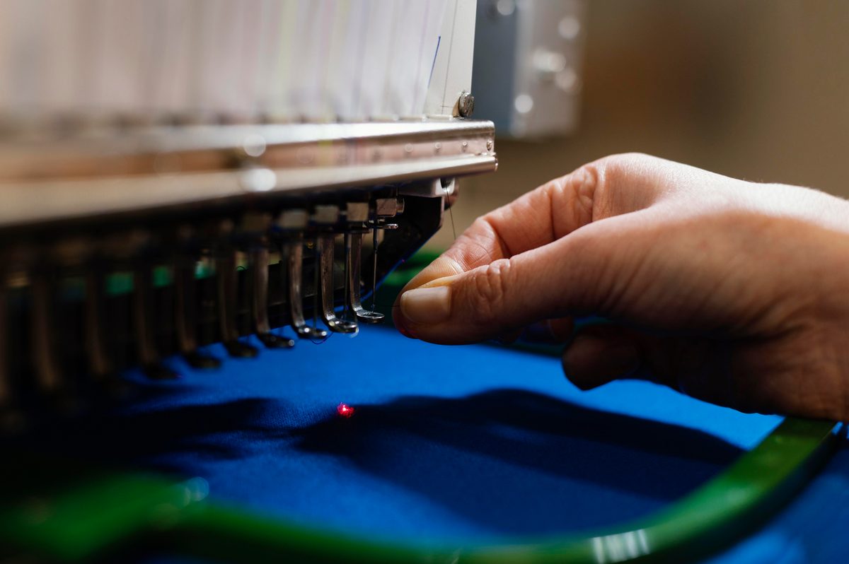 Embroidery machine stitching fabric